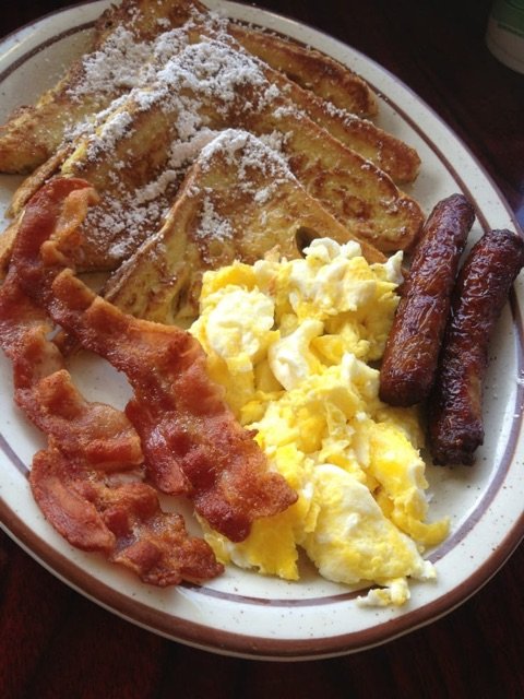 Golden French Toast Combo with Scrambled Eggs, Crisp Bacon and Sausage at Centinela Cafe